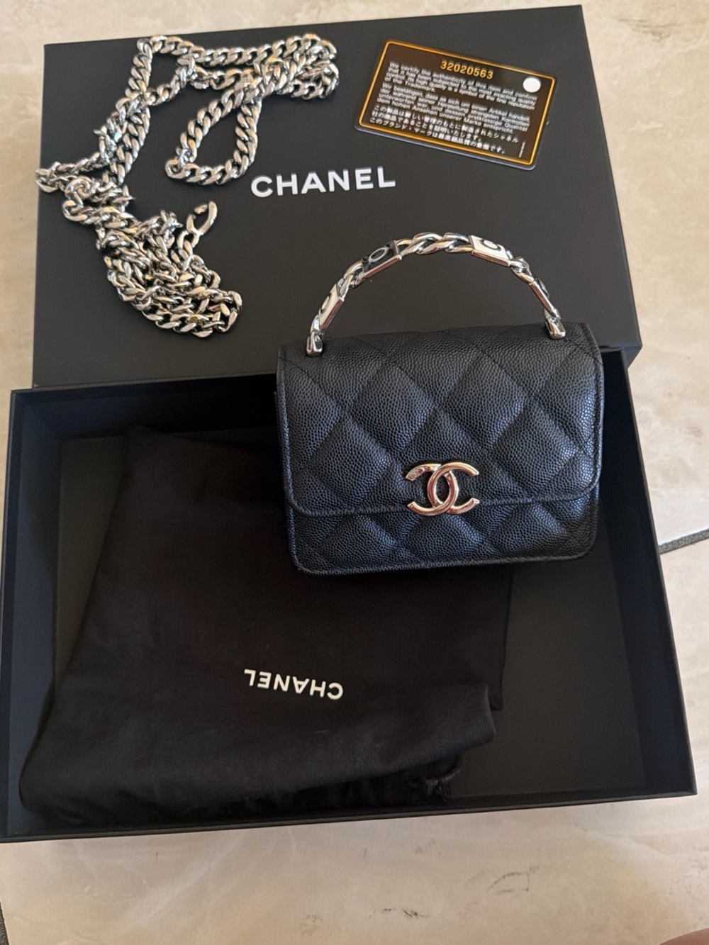 CHANEL Black Quilted Mini Top Handle Bag with Silver-Tone Hardware